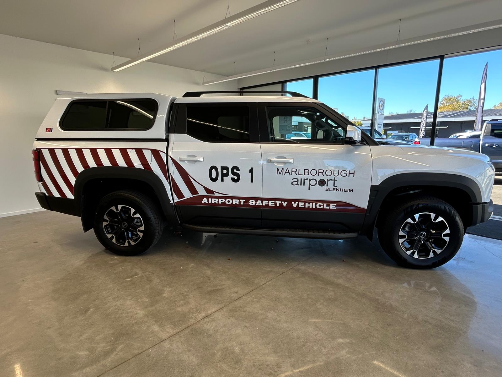BYD Shark 6 with Marlborough Airport sign writing