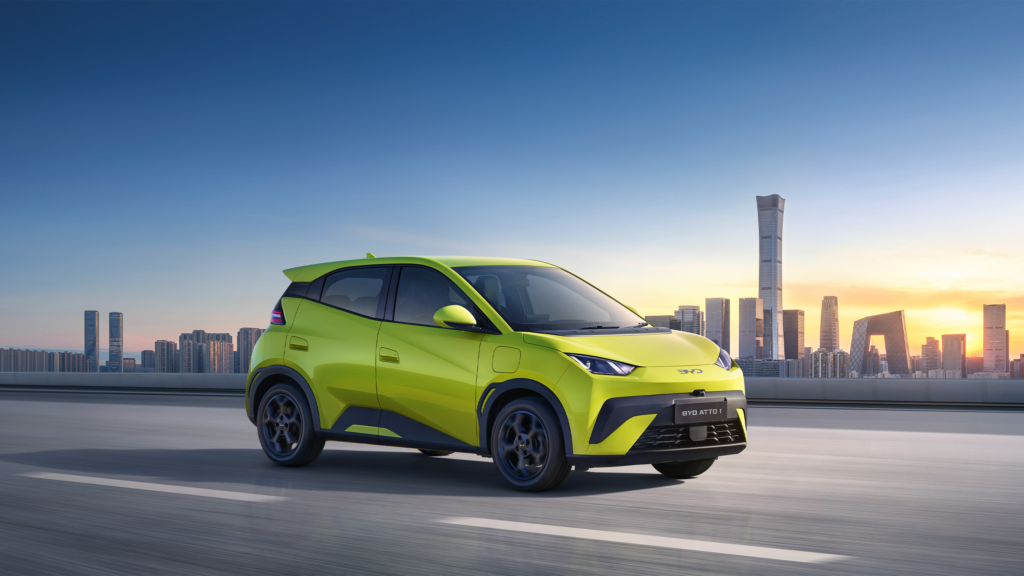 BYD Atto 1 Sprout Green in front of city scape