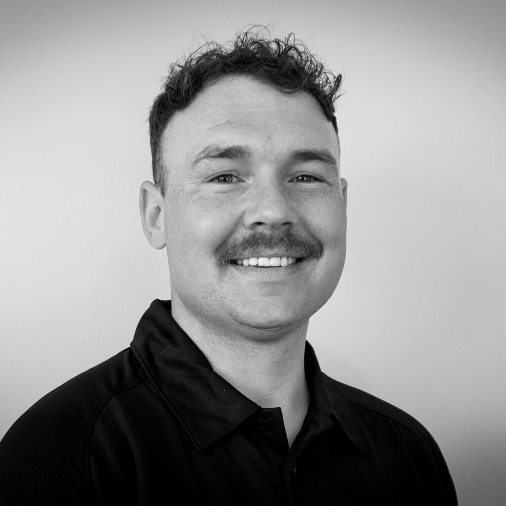 Taylor Towell, BYD Nelson Fleet Manager, Black and White headshot