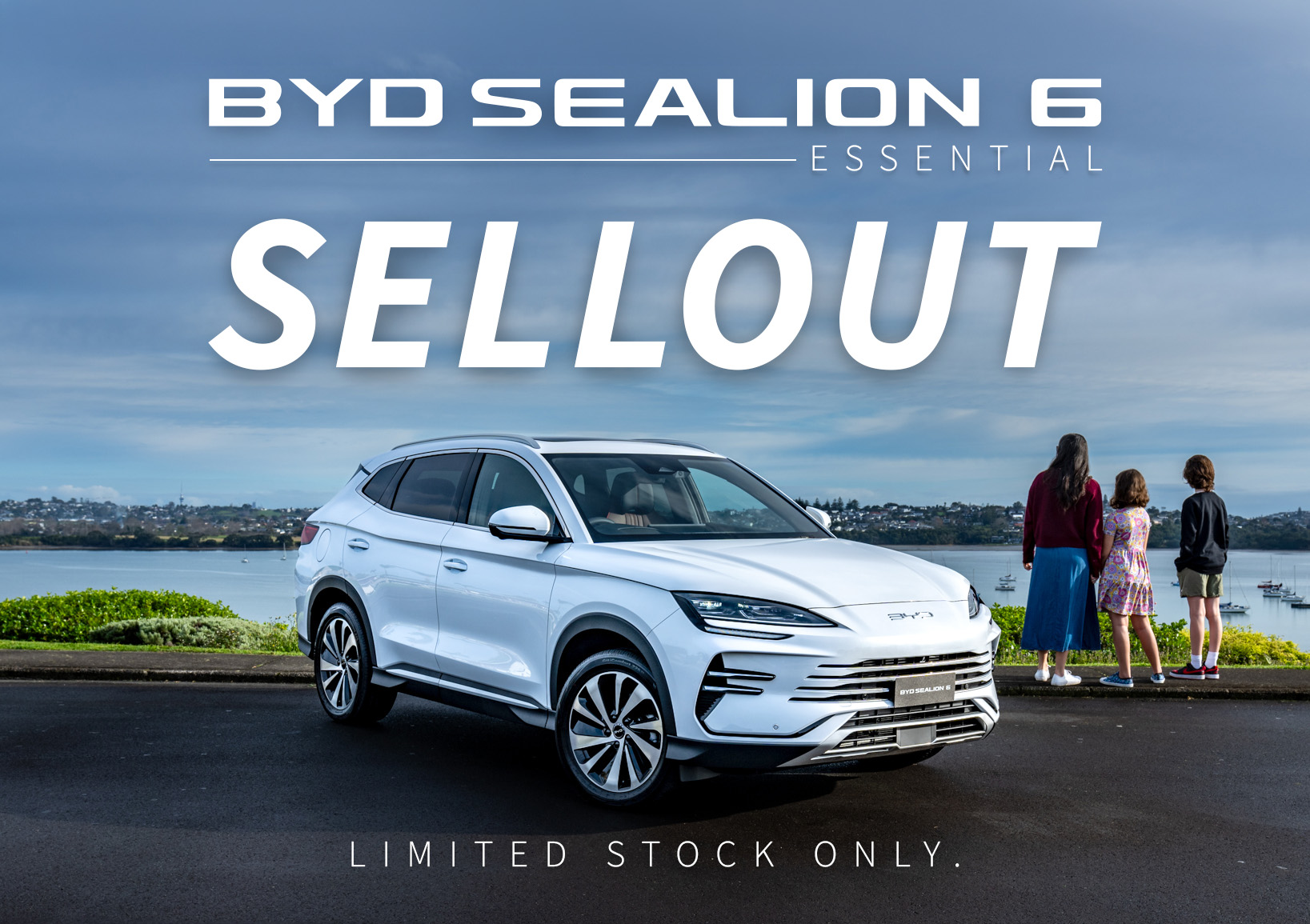 BYD Sealion 6 parked in front of ocean and family with words BYD Sealion 6 Sellout overlayed