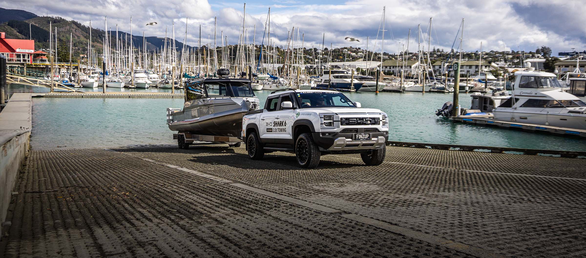 BYD Shark 6 Performance backing an Osprey 800HT down the Nelson Marina boat ramp in Summer.